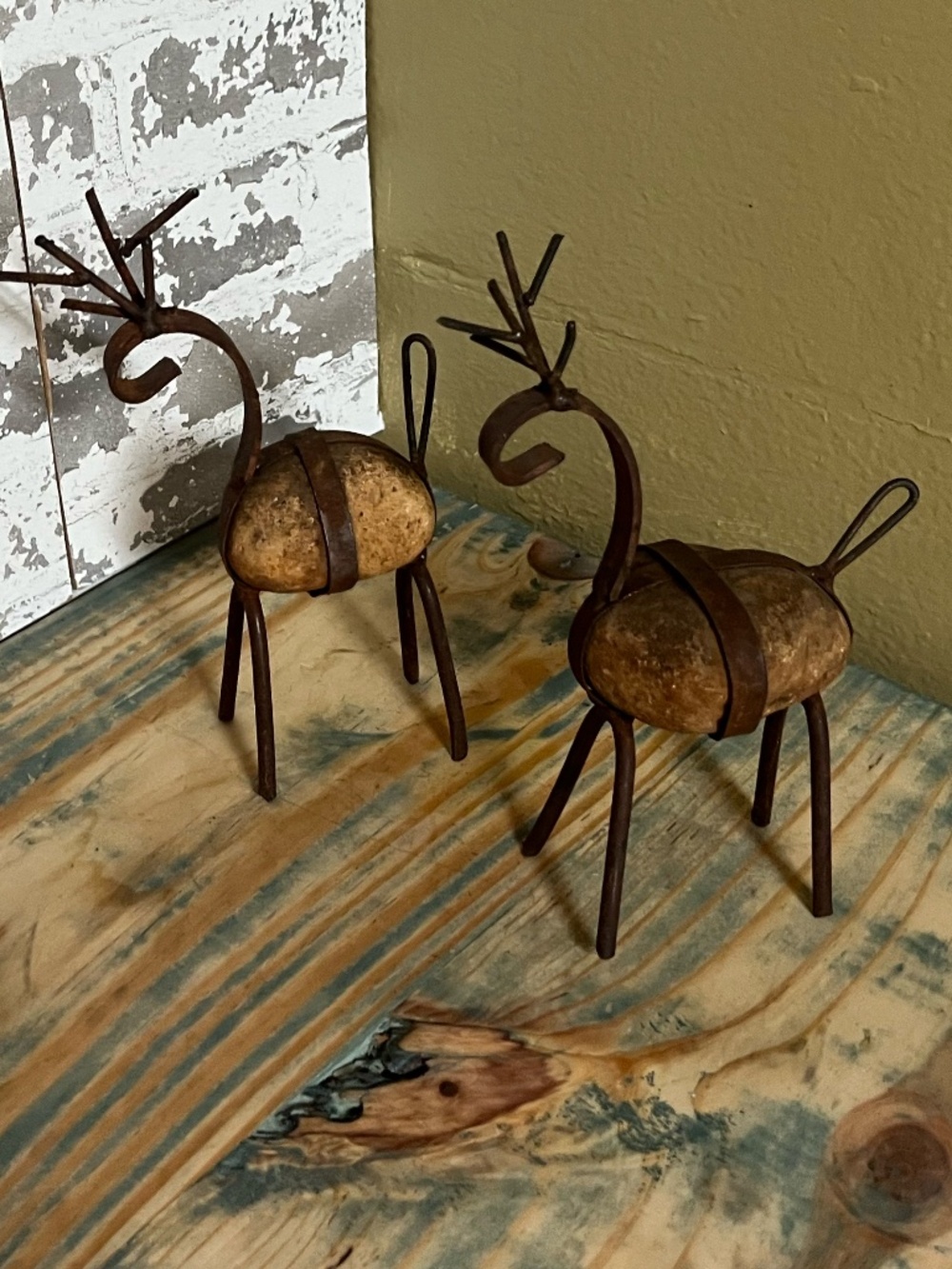 Christmas rounded stone body paired with rustic wrought iron antlers & legs